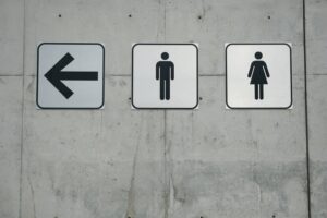 Men and Ladies Signs on Smooth Concrete Wall-cm