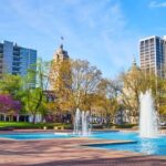 1490384736_Freimann Square park in downtown Fort Wayne in spring with cherry tree, fountains and courthouse_Large -cm