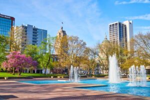 1490384736_Freimann Square park in downtown Fort Wayne in spring with cherry tree, fountains and courthouse_Large -cm